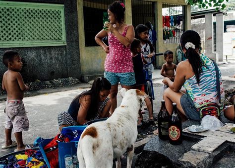 At Manila North Cemetery, the living make their .